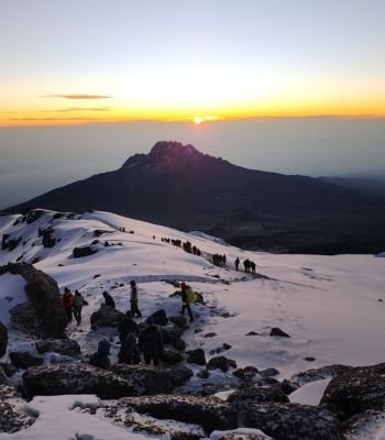 Mount Kilimanjaro summit sunrise view with snow and Uhuru Peak