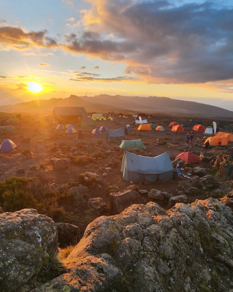 Mount Kilimanjaro sunset view with climbers on the trail