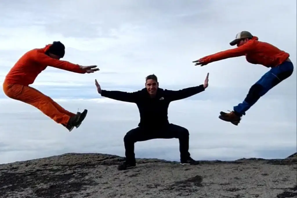 Climbers reaching the top of Barranco Wall on the Machame Route during a Mount Kilimanjaro trek with stunning views after the famous Barranco Wall climb.