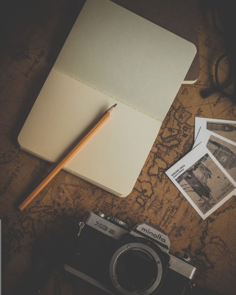 Travel planning notebook and camera for Tanzania day trips and safari preparation