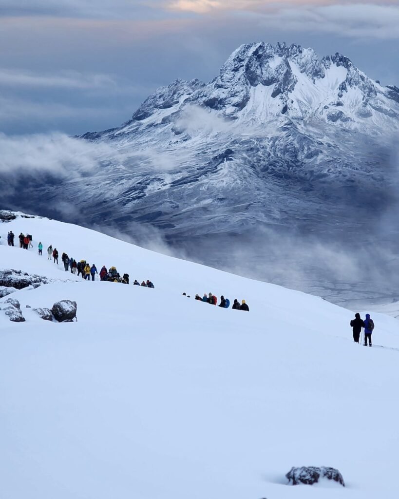Mount Kilimanjaro snow summit landscape with climbers in arctic zone Tanzania