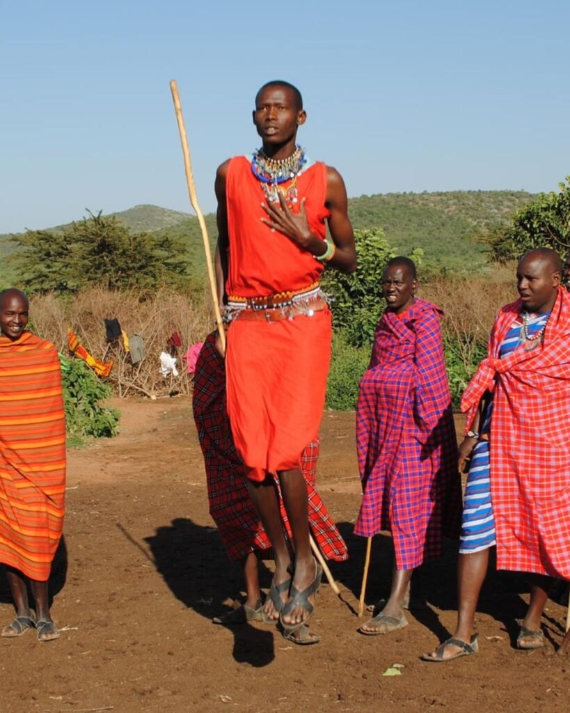 Maasai people in traditional clothing during cultural experience in Tanzania village
