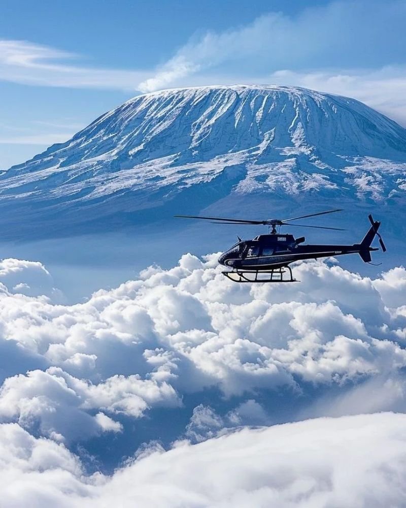 Luxury helicopter tour over Mount Kilimanjaro in Tanzania with breathtaking aerial mountain views