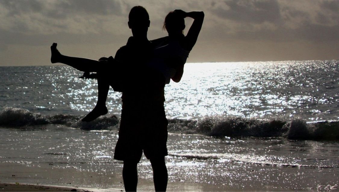 Couple enjoying a romantic sunset during a Tanzania honeymoon safari